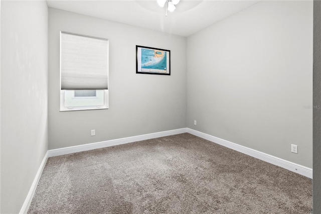 carpeted empty room featuring ceiling fan