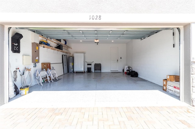 garage with electric water heater, electric panel, and a garage door opener