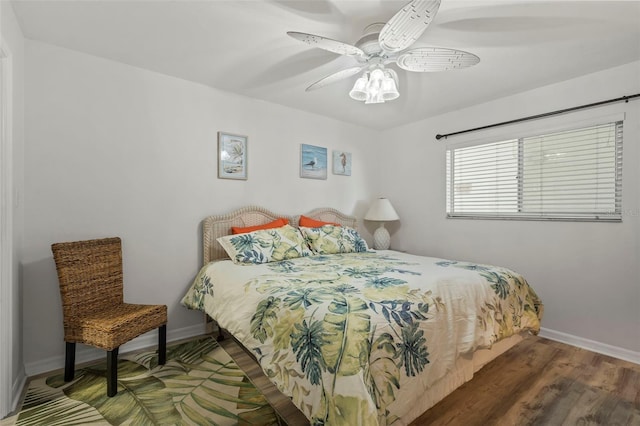 bedroom featuring ceiling fan and hardwood / wood-style flooring