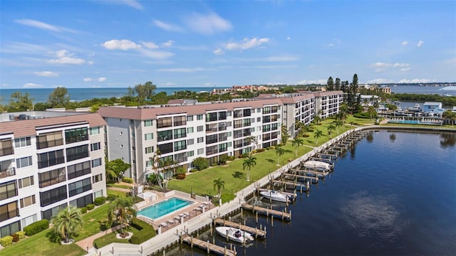 birds eye view of property with a water view