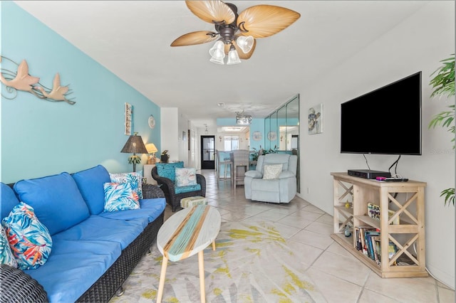 tiled living room with ceiling fan