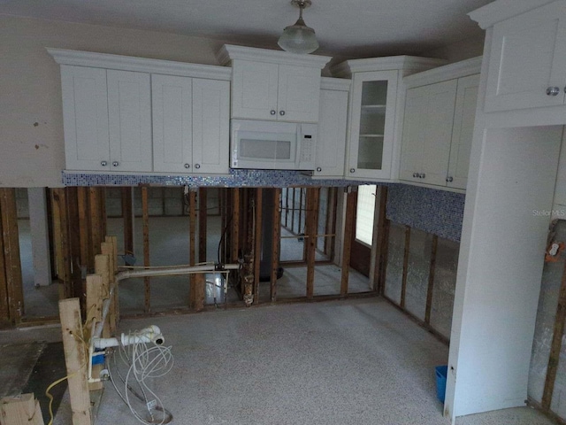 kitchen featuring white cabinets