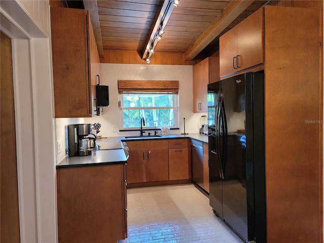 kitchen featuring black fridge, stainless steel dishwasher, wood ceiling, sink, and beamed ceiling