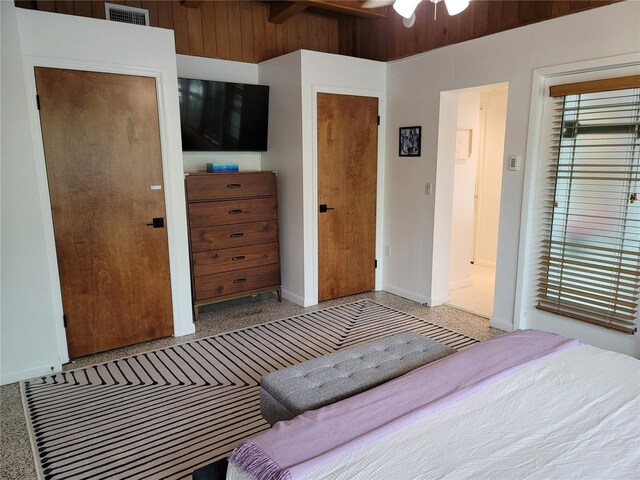 bedroom with speckled floor, baseboards, and visible vents