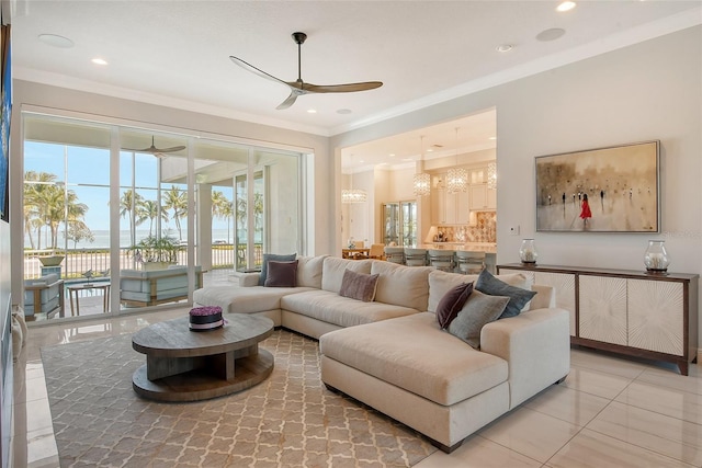 living room featuring tile patterned flooring, ceiling fan, and ornamental molding