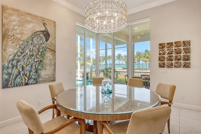 dining area with a water view, crown molding, light tile patterned floors, and a notable chandelier