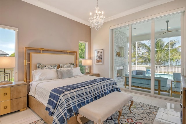 bedroom featuring ornamental molding, a large fireplace, access to outside, light tile patterned floors, and an inviting chandelier