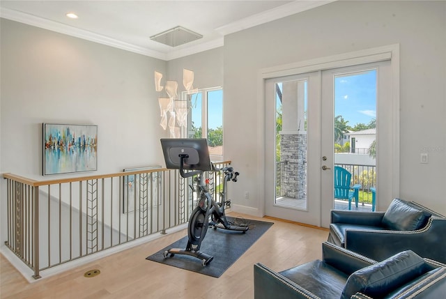 exercise area with french doors, wood-type flooring, and ornamental molding