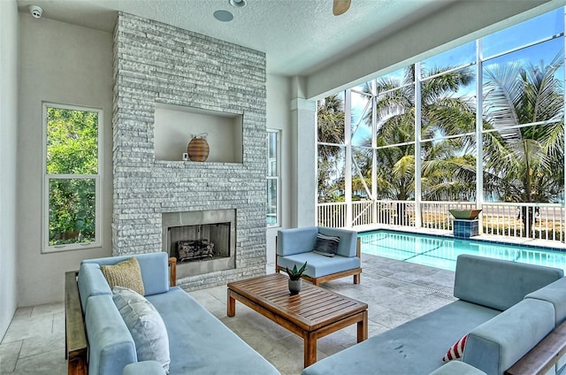 interior space with a fireplace and a textured ceiling