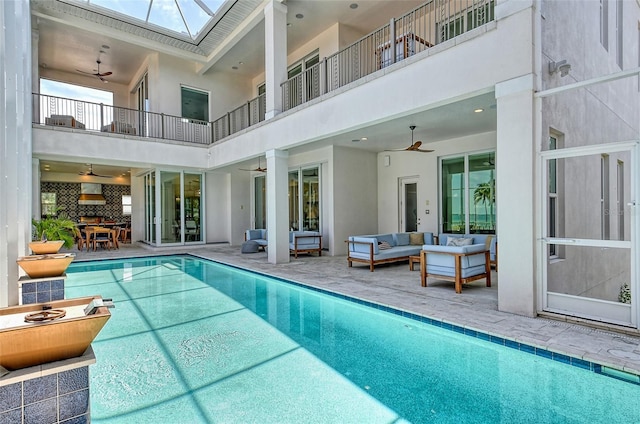 view of swimming pool featuring an outdoor living space and a patio