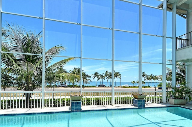 view of pool with a water view