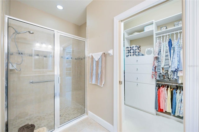 bathroom featuring tile patterned flooring and a shower with shower door