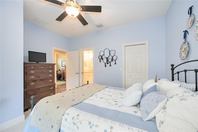 carpeted bedroom with connected bathroom, a closet, and ceiling fan