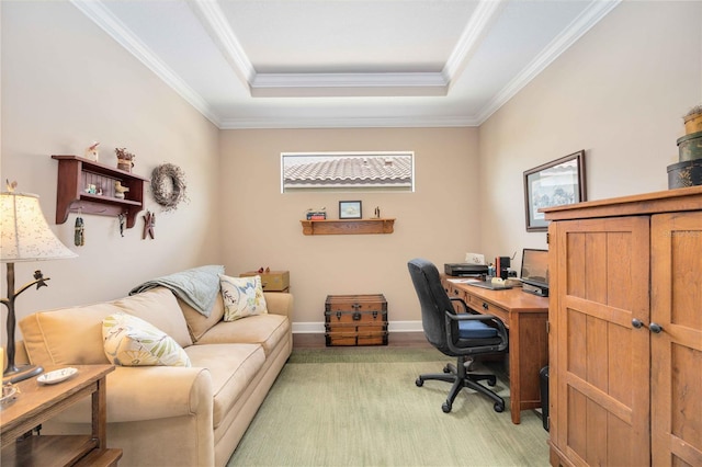 office with a tray ceiling, crown molding, and light wood-type flooring