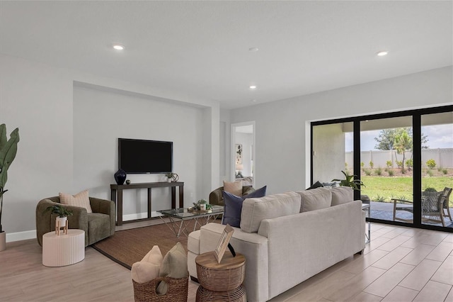 living room with light hardwood / wood-style flooring