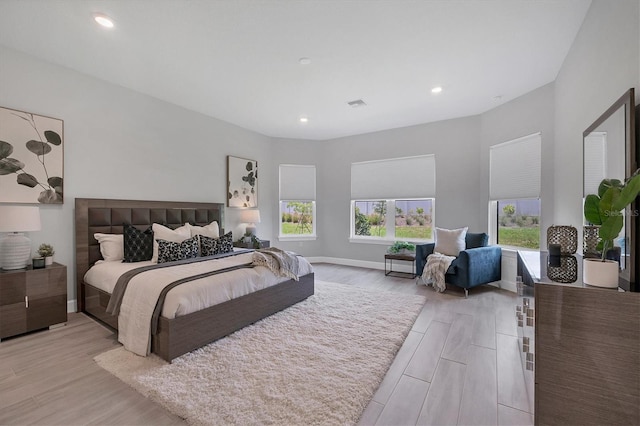 bedroom with light hardwood / wood-style flooring