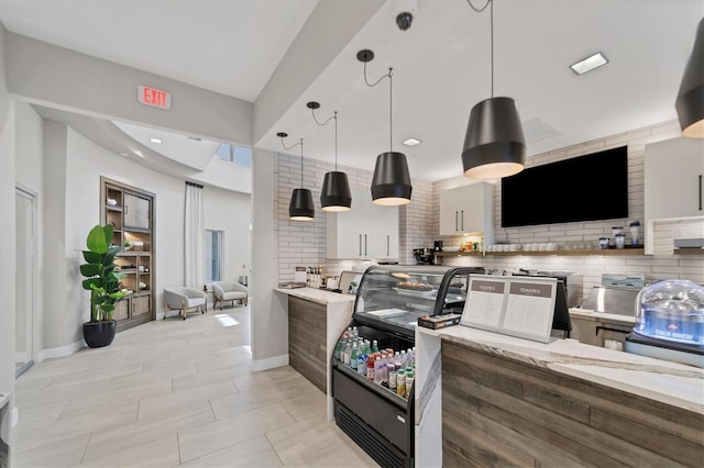 kitchen featuring hanging light fixtures and tasteful backsplash