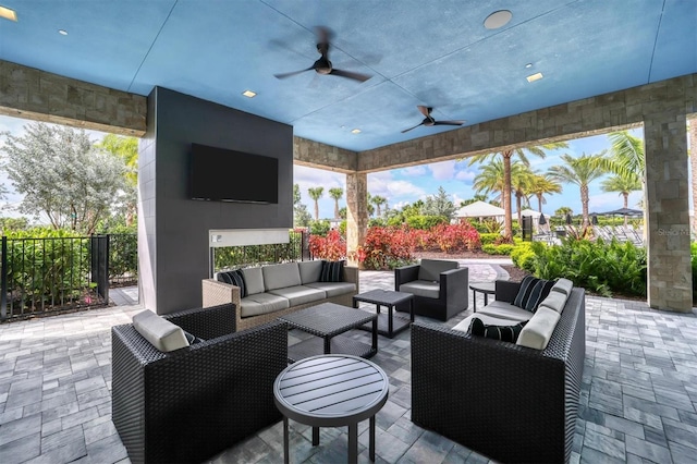 view of patio with outdoor lounge area and ceiling fan