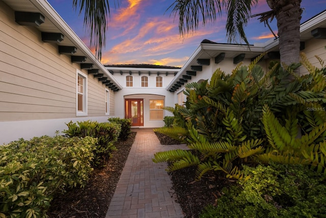 exterior entry at dusk with french doors