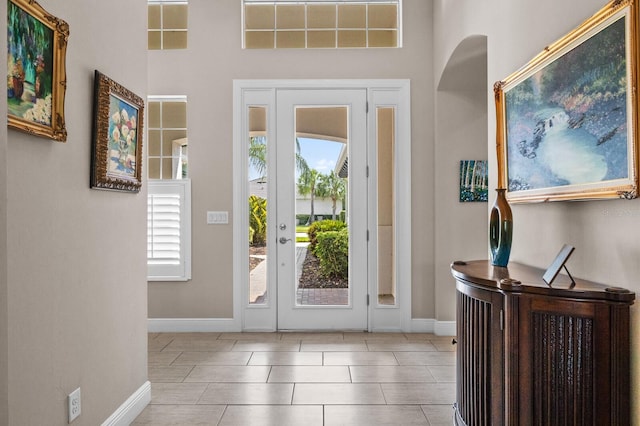 foyer entrance featuring light tile patterned floors