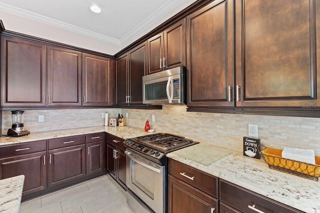 kitchen featuring decorative backsplash, appliances with stainless steel finishes, light stone countertops, ornamental molding, and light tile patterned floors