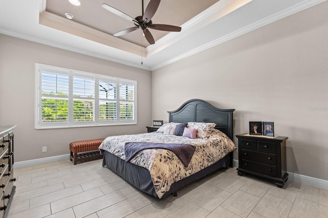 bedroom featuring a raised ceiling, ceiling fan, and ornamental molding