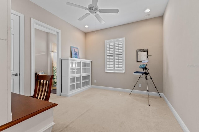 misc room featuring ceiling fan and light carpet