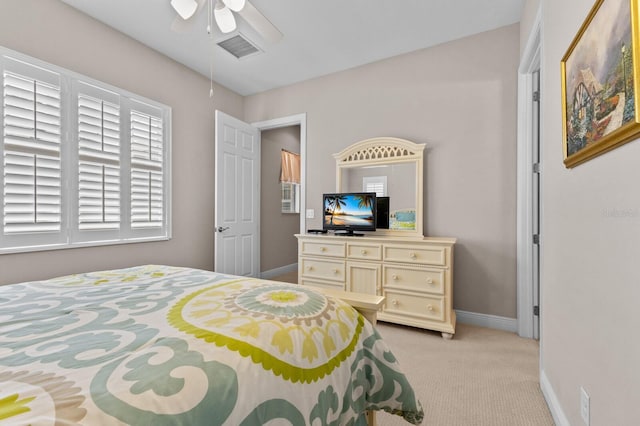 bedroom featuring ceiling fan and light colored carpet