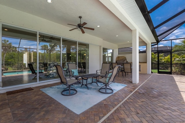 unfurnished sunroom featuring ceiling fan