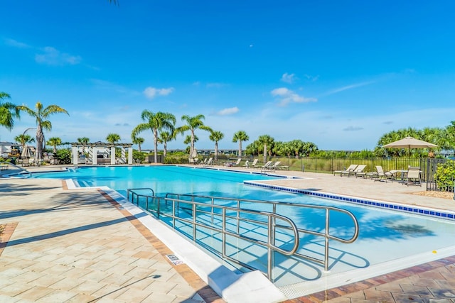 view of swimming pool with a patio