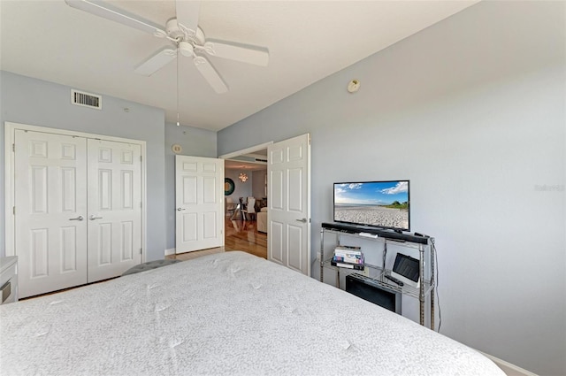 bedroom with ceiling fan and a closet