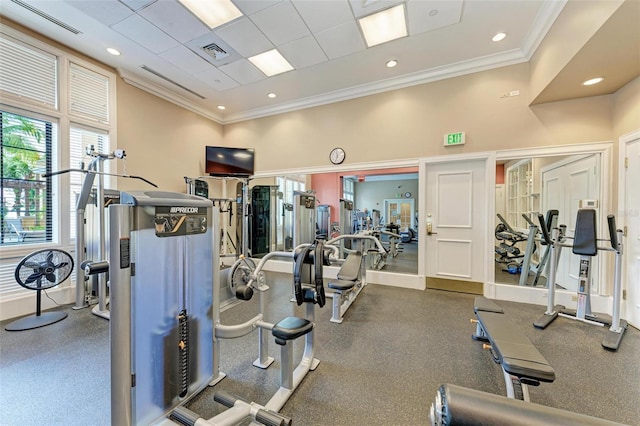 gym featuring a drop ceiling and crown molding