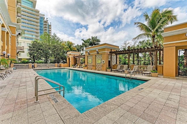 view of pool featuring a pergola and a patio