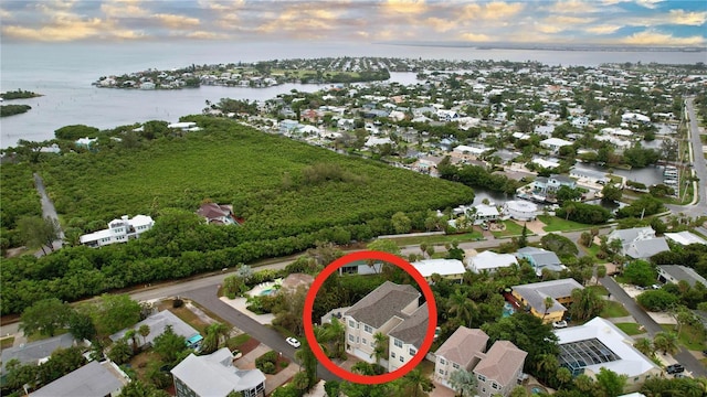 aerial view at dusk with a water view