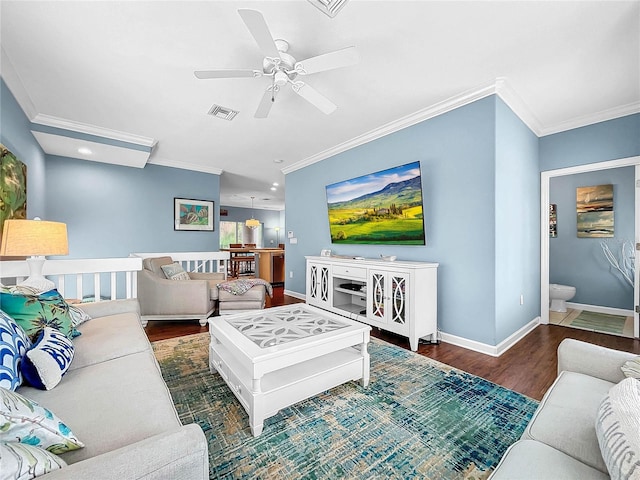 living room featuring crown molding, ceiling fan, and dark hardwood / wood-style floors