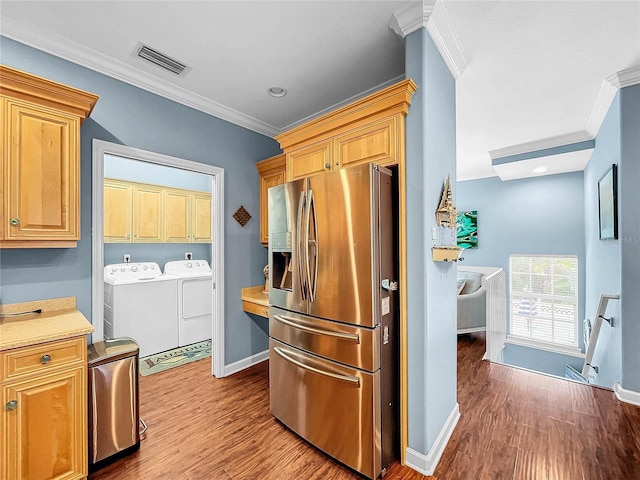 kitchen featuring stainless steel refrigerator with ice dispenser, ornamental molding, separate washer and dryer, and hardwood / wood-style flooring