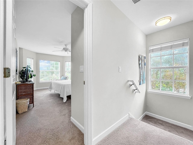 interior space with ceiling fan