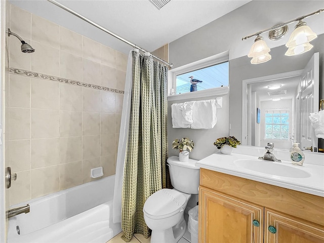 full bathroom featuring tile patterned flooring, vanity, shower / tub combo with curtain, and toilet