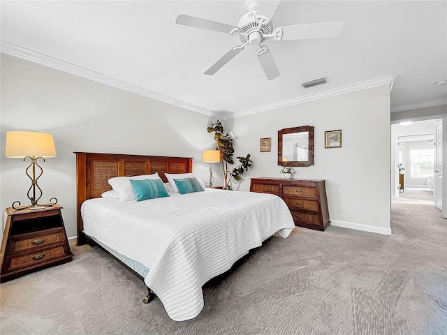 carpeted bedroom featuring ceiling fan and ornamental molding