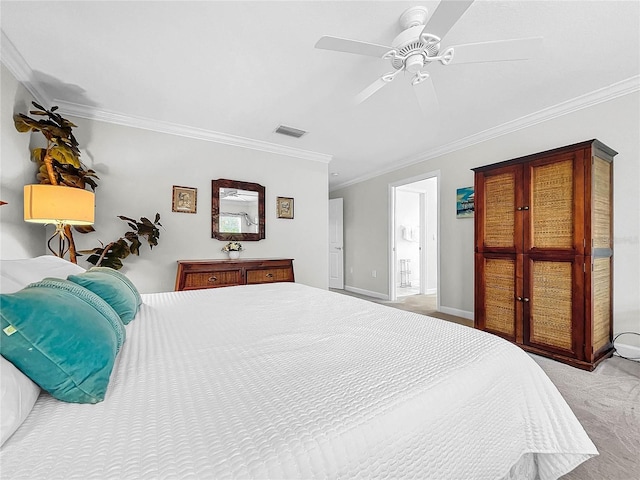 carpeted bedroom featuring crown molding, ceiling fan, and ensuite bathroom