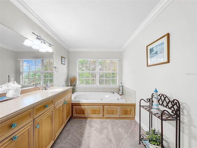 bathroom with vanity, ornamental molding, and a bathing tub