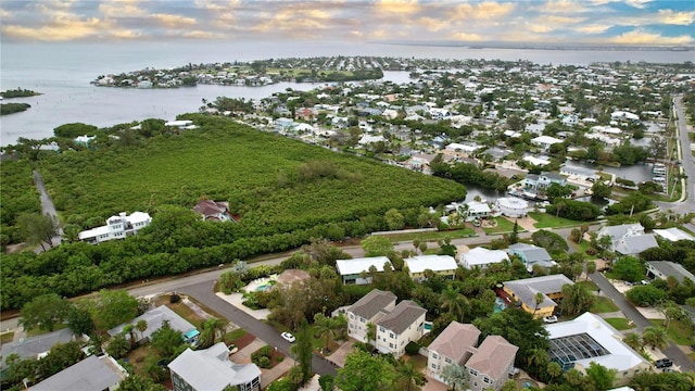 aerial view at dusk with a water view