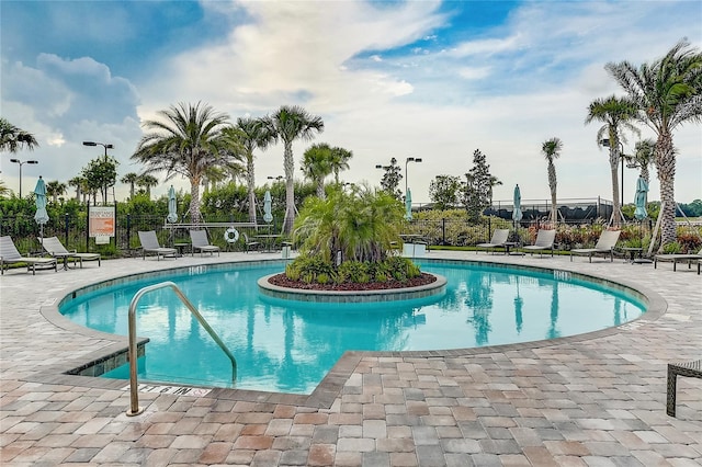 view of swimming pool with a patio area