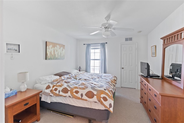 bedroom with ceiling fan and light colored carpet