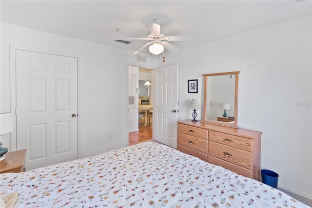 bedroom featuring ceiling fan and hardwood / wood-style floors