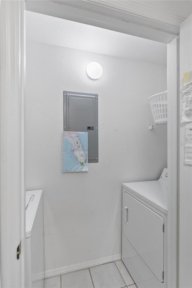 laundry area with light tile flooring and washer / dryer