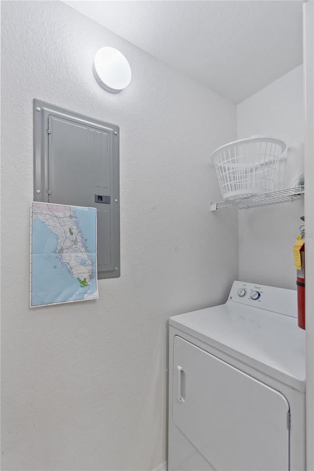 clothes washing area with washer / clothes dryer