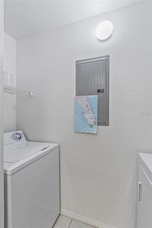 laundry room featuring light tile floors