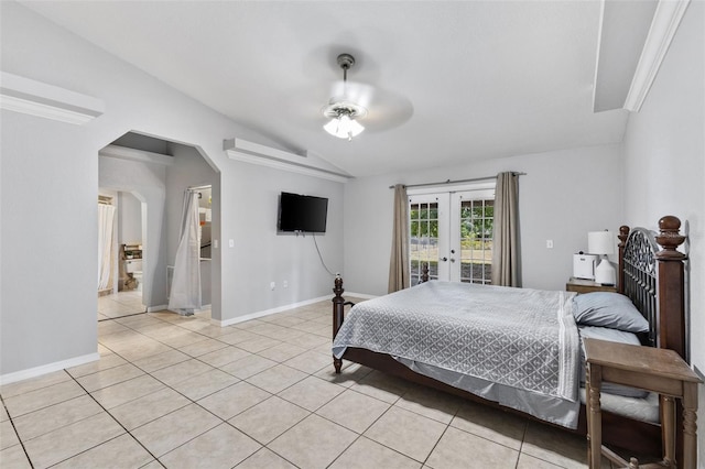 tiled bedroom with ceiling fan, lofted ceiling, access to outside, and french doors