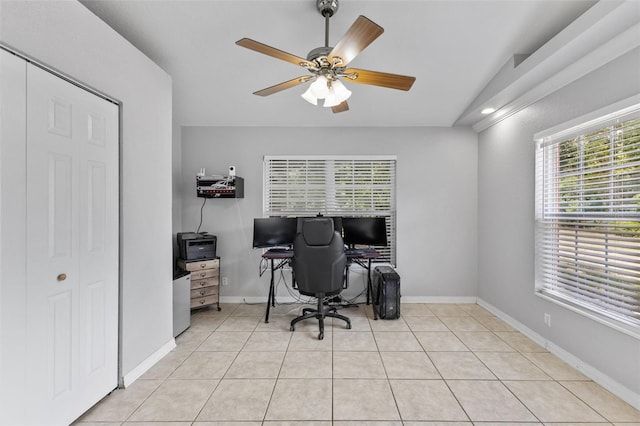 tiled home office with ceiling fan and lofted ceiling